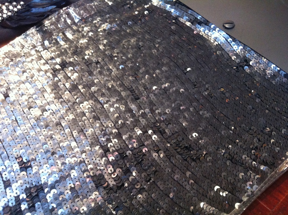 My second favourite - this is a matt black sequinned fabric with the sequins sewn in the row. Given the sample instore has packing tape down the cut sides, I'm wary of this one because those sequins would so easily become undone. during cutting/sewing. Wide seam allowances would definitely be required.