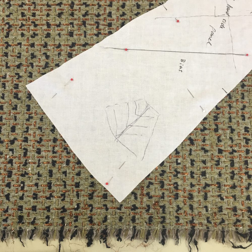 Ros is sewing with a really fascinating fabric in an olive green that has Navy and copper highlights. She's also having a bias panel down the sides of her jacket - which entails an epic amount of quilting! Ros is two sizes different across her hips to her upper torso, and this additional bias panel does beautiful justice to her curves. Check out her smile here!